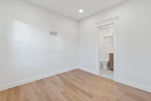 an empty room with closet area