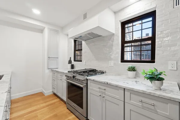 a kitchen with sink and window