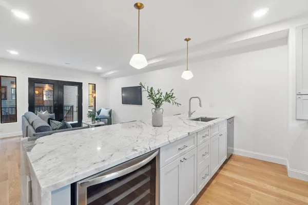 a kitchen with stainless steel appliances granite countertop a stove and a sink