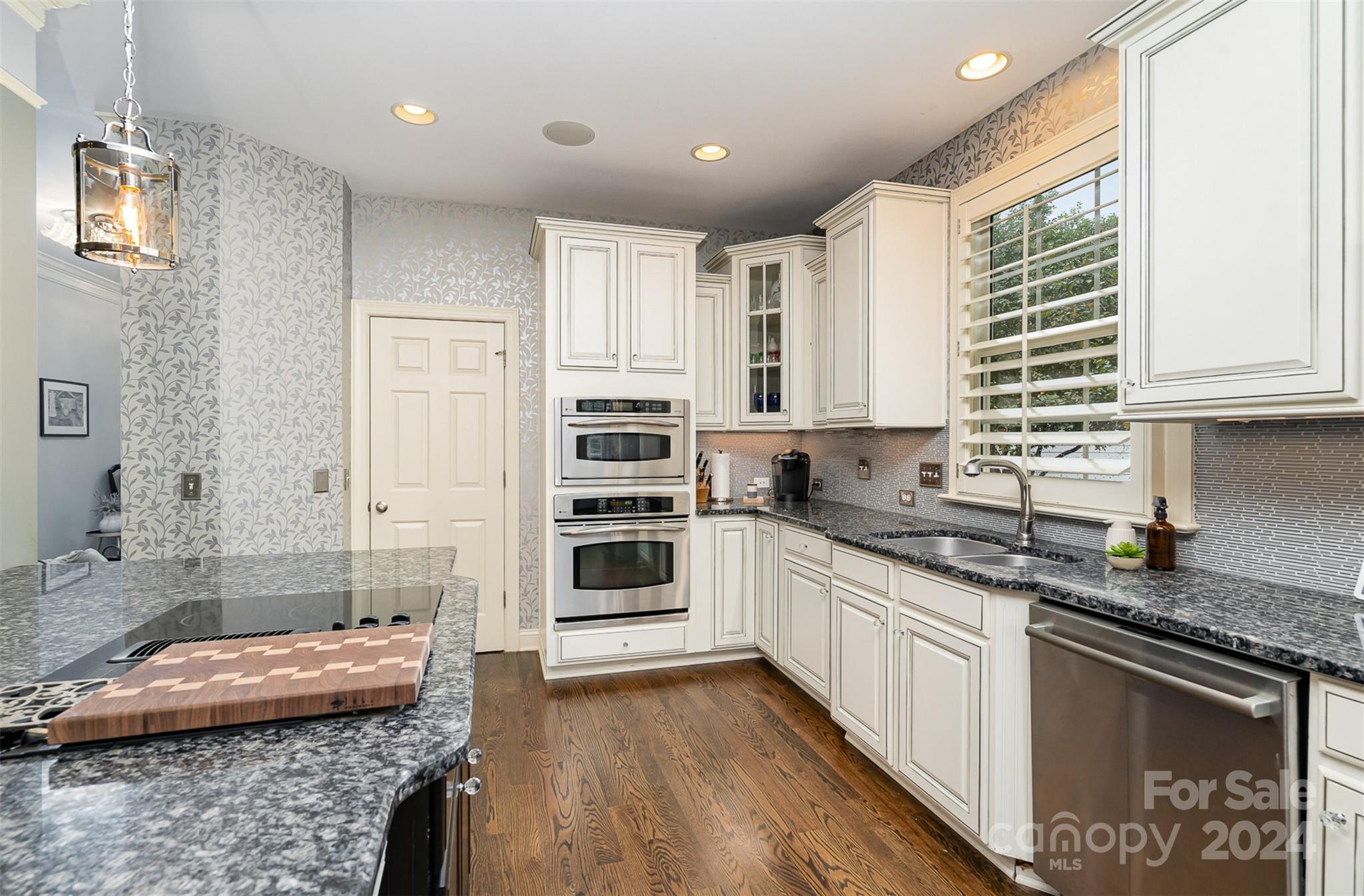 5324 Maddox Court Fort Mill, SC 29708 - Photo 18 of 48 a kitchen with stainless steel appliances granite countertop a stove a sink and a microwave