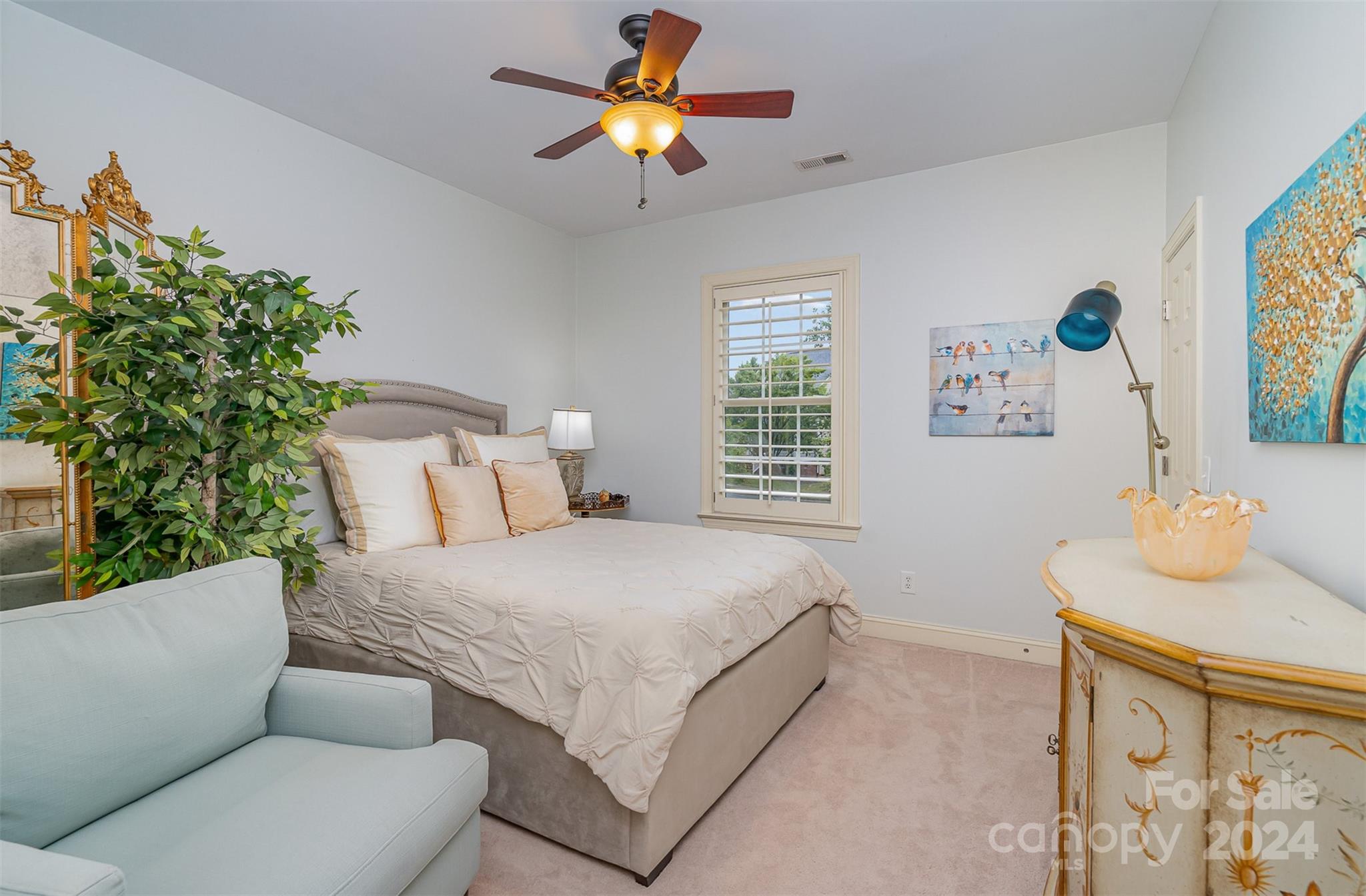 5324 Maddox Court Fort Mill, SC 29708 - Photo 27 of 48 a bedroom with a bed and a chandelier