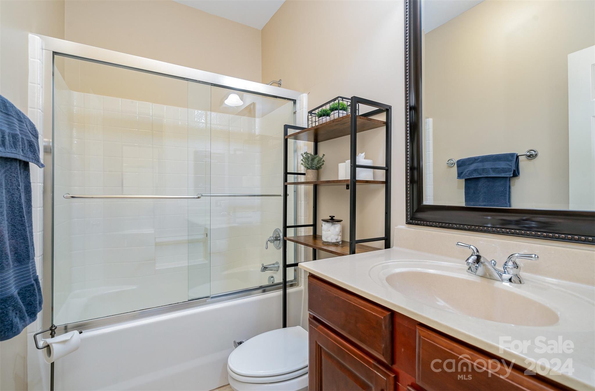 5324 Maddox Court Fort Mill, SC 29708 - Photo 28 of 48 a bathroom with a granite countertop sink toilet and shower
