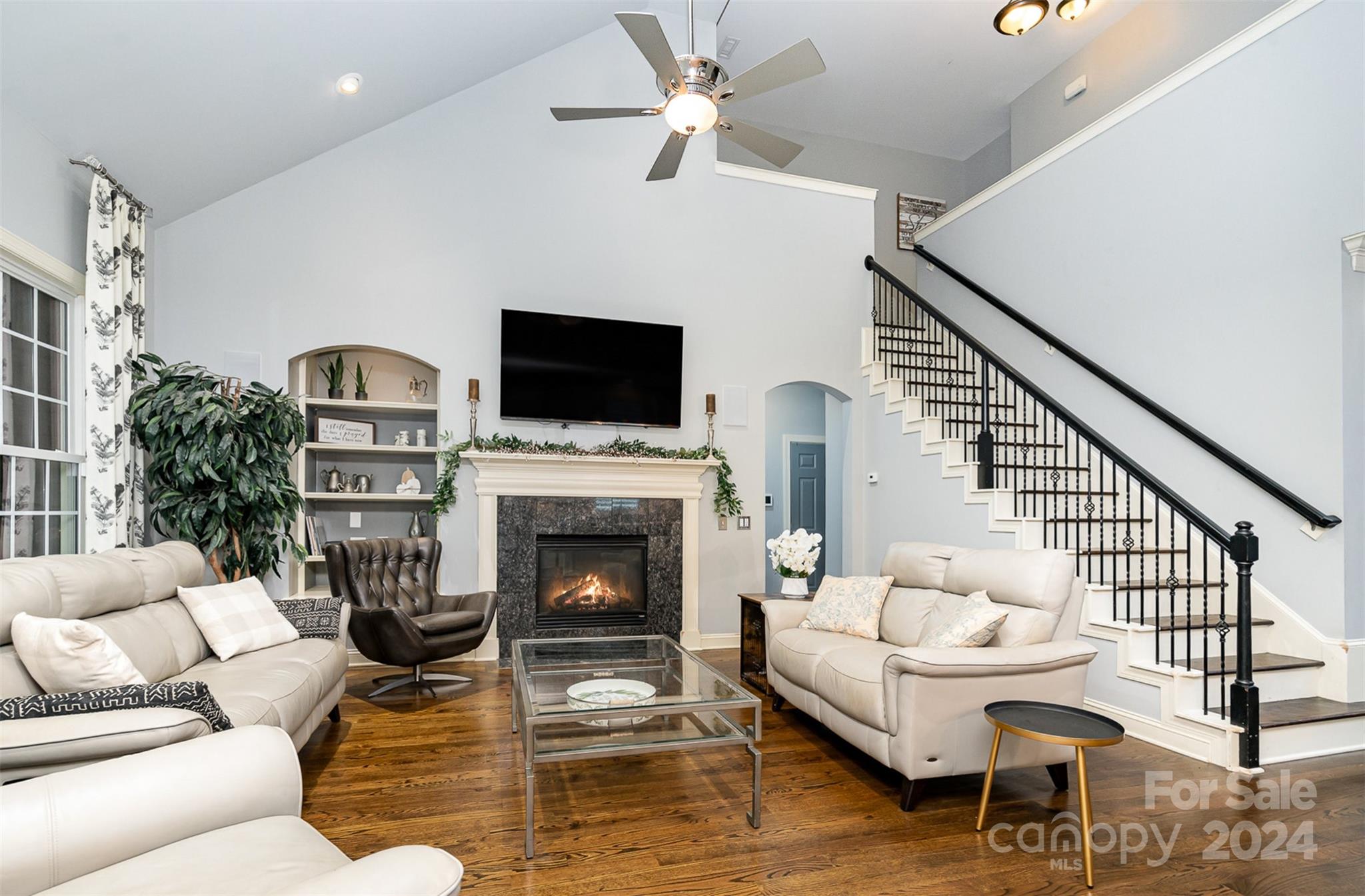 5324 Maddox Court Fort Mill, SC 29708 - Photo 9 of 48 a living room with furniture a fireplace and a flat screen tv