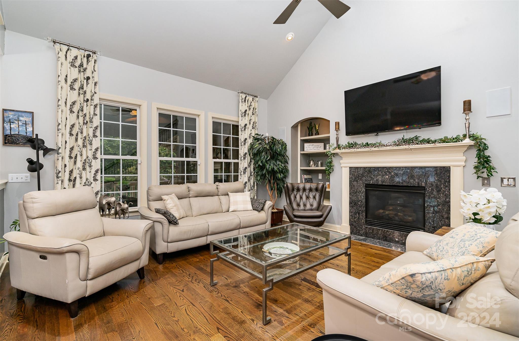 5324 Maddox Court Fort Mill, SC 29708 - Photo 10 of 48 a living room with furniture a fireplace and a flat screen tv