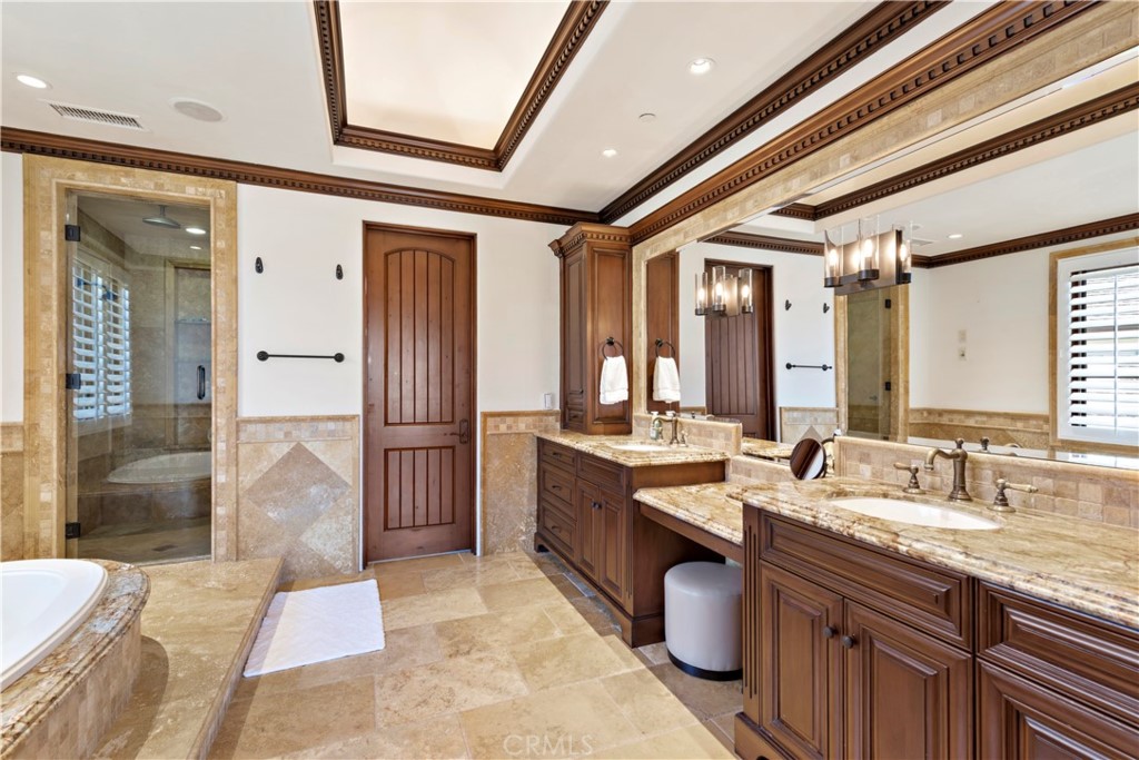 3 Fox Hole Road Ladera Ranch, CA 92694 - Photo 26 of 57 a large bathroom with a granite countertop sink a toilet a mirror and shower