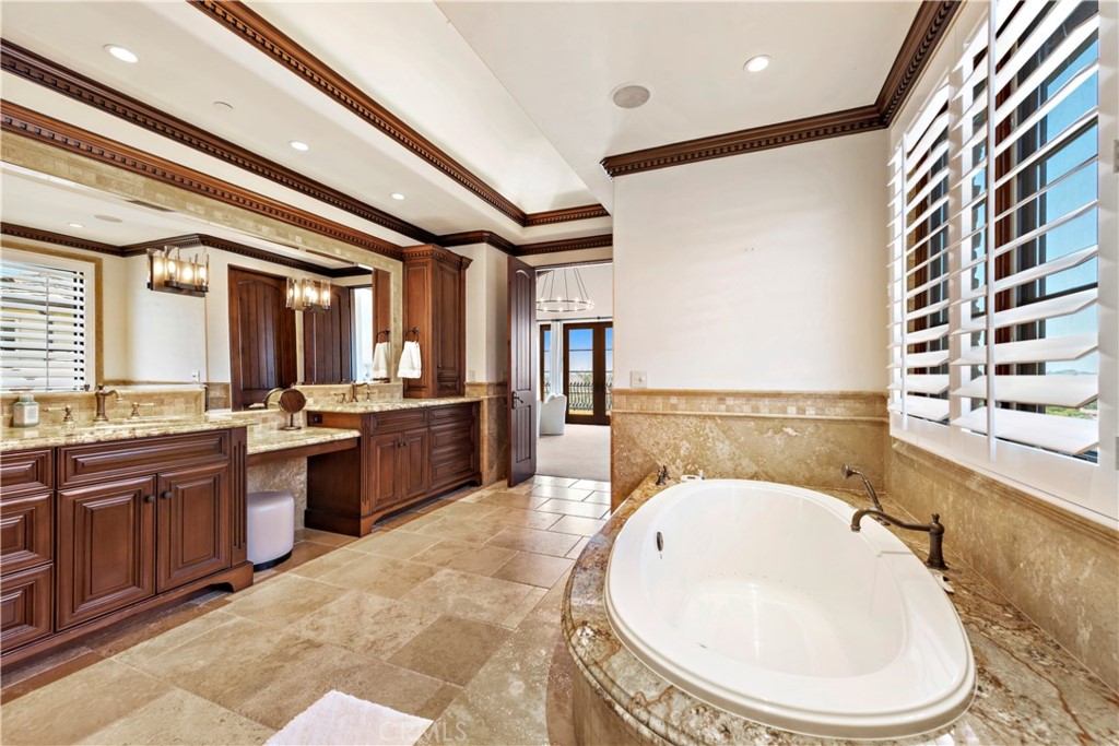 3 Fox Hole Road Ladera Ranch, CA 92694 - Photo 28 of 57 a en suite bathroom with a granite countertop sink and a bathtub