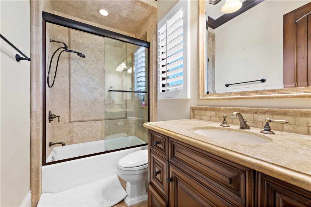 3 Fox Hole Road Ladera Ranch, CA 92694 - Photo 33 of 57 a bathroom with a granite countertop sink a toilet and shower