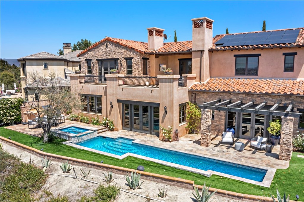 3 Fox Hole Road Ladera Ranch, CA 92694 - Photo 49 of 57 a front view of a house with swimming pool outdoor seating