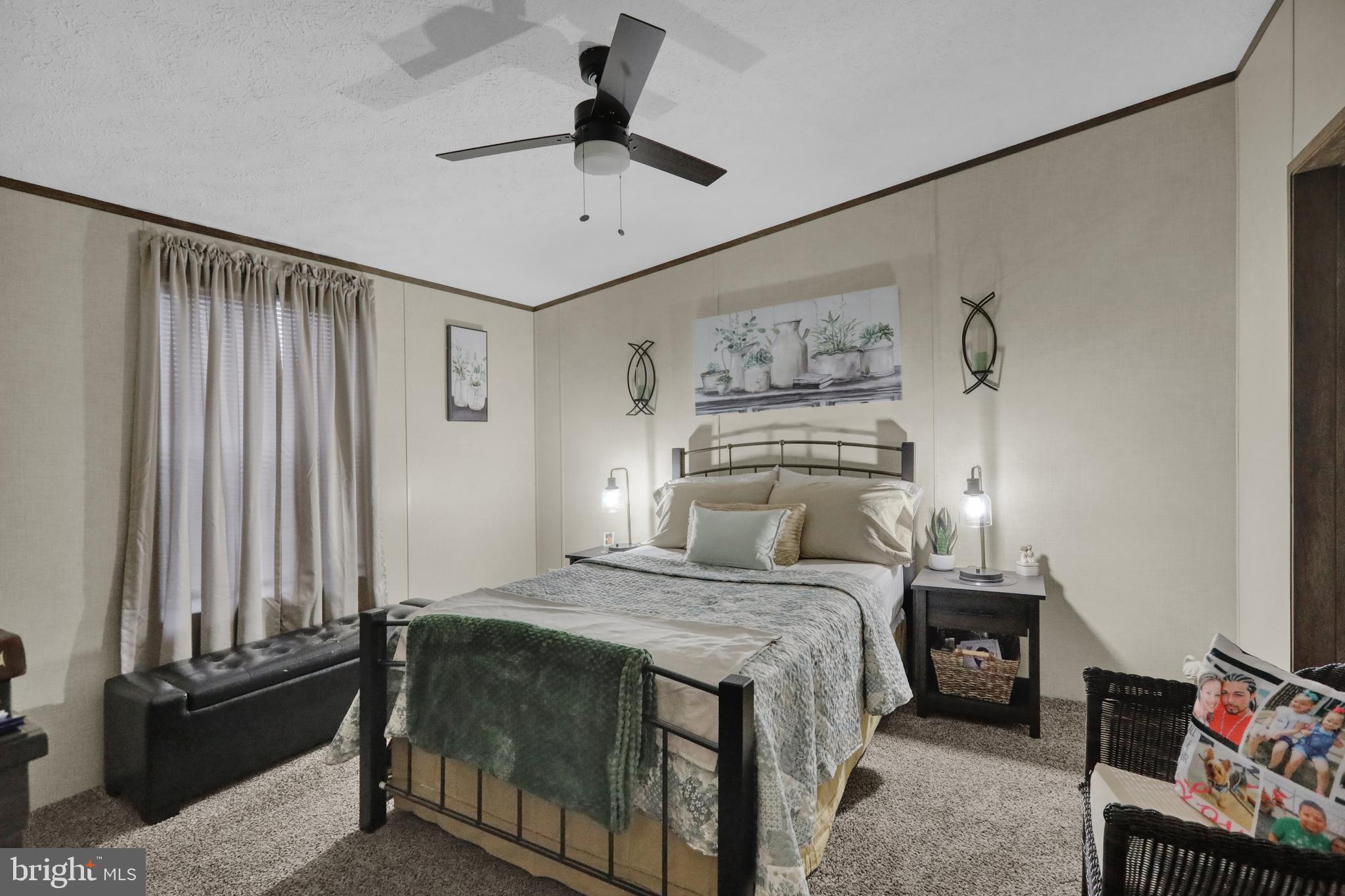 21 Keystone Road Reading, PA 19606 - Photo 11 of 22 a bedroom with a bed and a chandelier