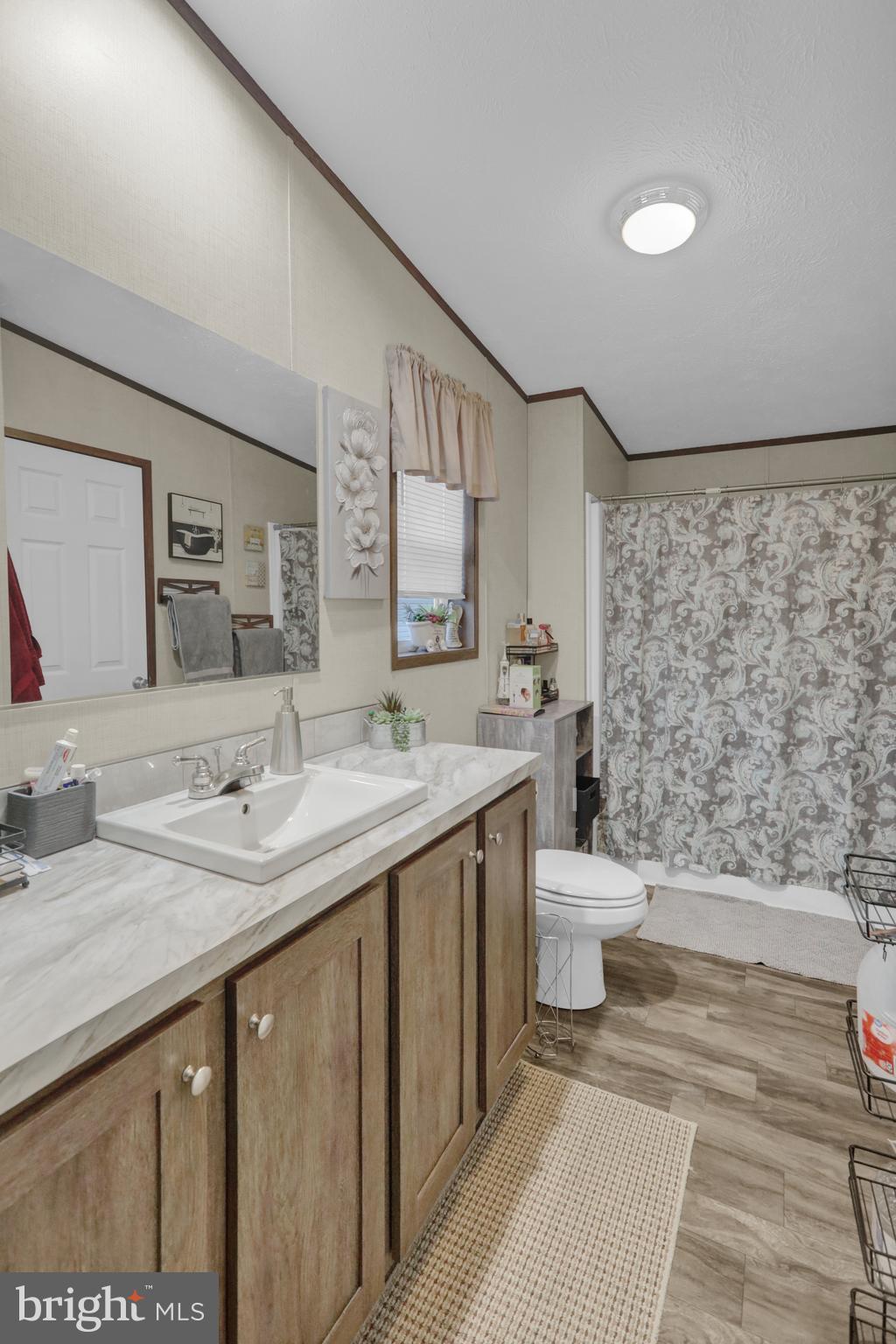 21 Keystone Road Reading, PA 19606 - Photo 15 of 22 a bathroom with a double vanity sink toilet and a mirror