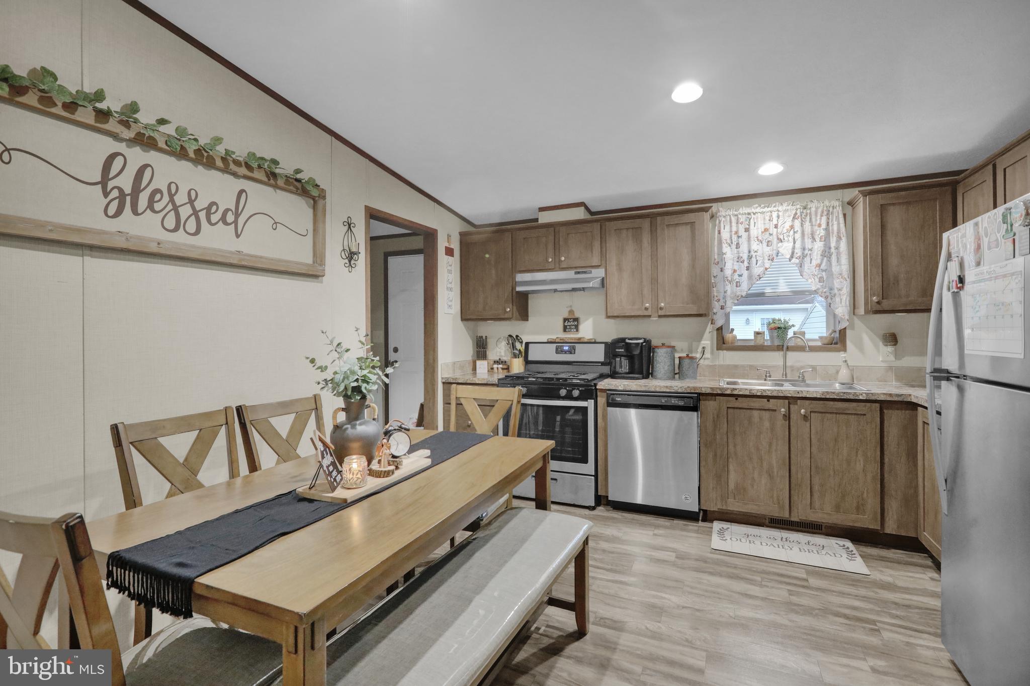 21 Keystone Road Reading, PA 19606 - Photo 10 of 22 a kitchen with refrigerator cabinets and a table