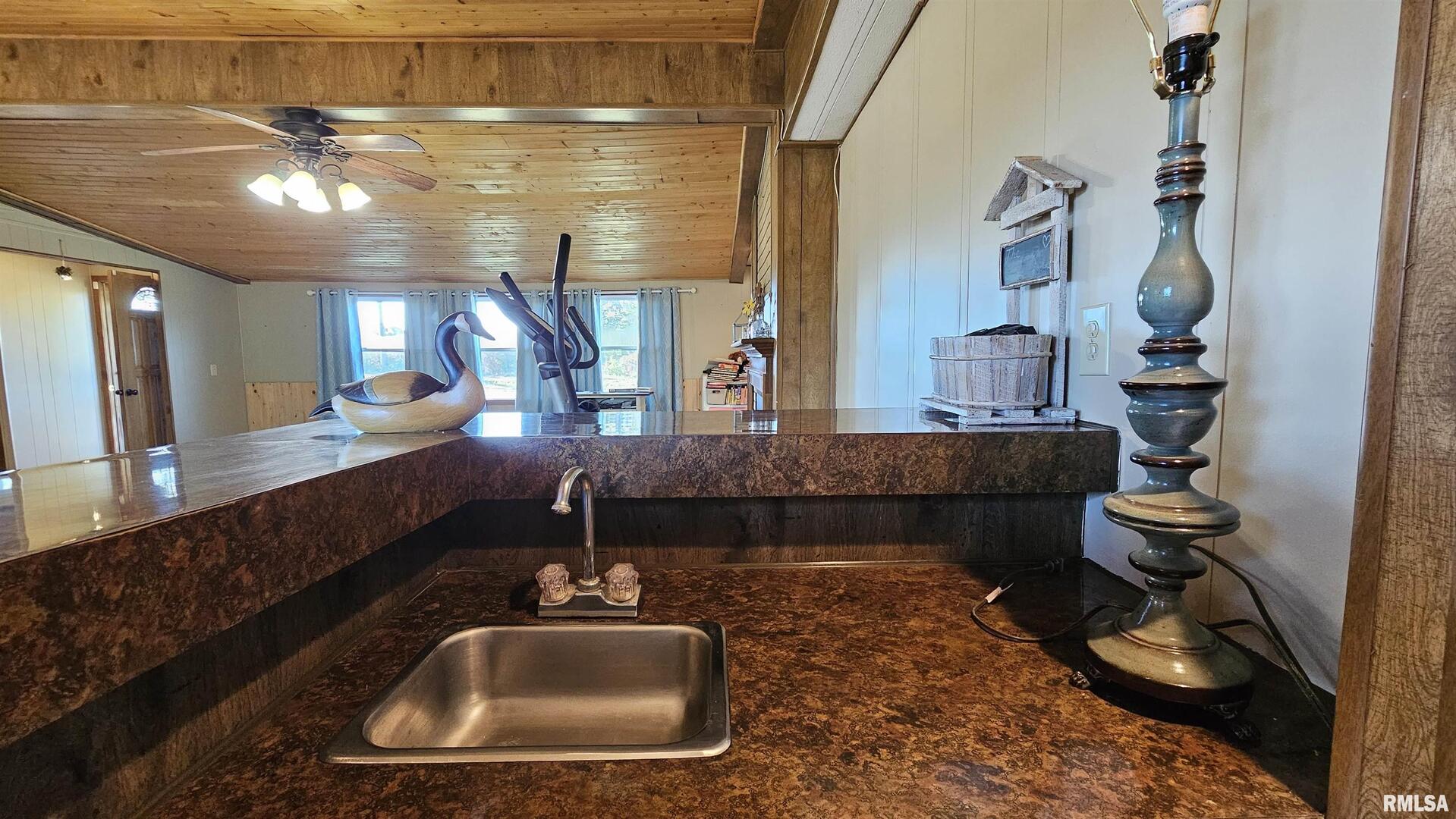 14228 Lake Of Egypt Road Marion, IL 62959 - Photo 21 of 41 a bathroom with a sink and a mirror