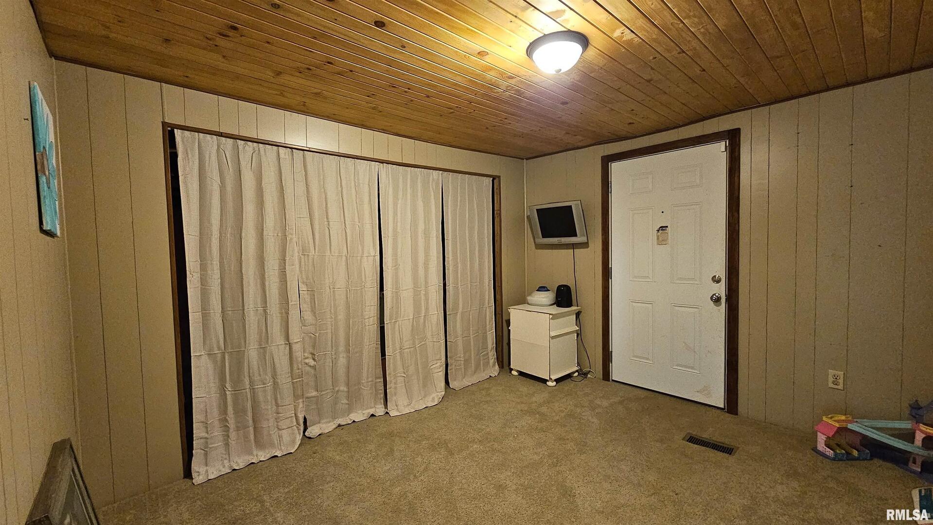 14228 Lake Of Egypt Road Marion, IL 62959 - Photo 10 of 41 a view of a livingroom with an empty space and a hallway