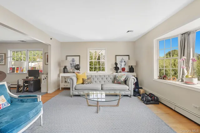 a living room with furniture and a window