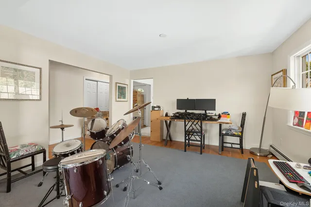 a living room with furniture a couch and a window