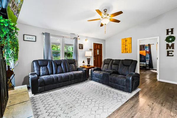 a kitchen with a refrigerator sink and cabinets