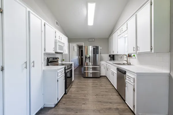 a close up of a stove top oven sitting inside of a kitchen