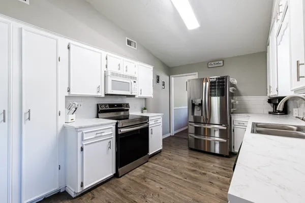 a bedroom with furniture and a window