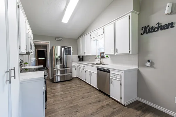 a bathroom with a granite countertop sink a mirror and a