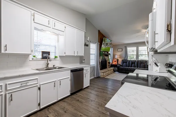 a white toilet sitting next to a bathroom sink
