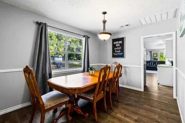 a bedroom with bed and wooden floor