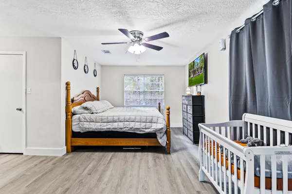 a bathroom with a sink a toilet a shower and a mirror