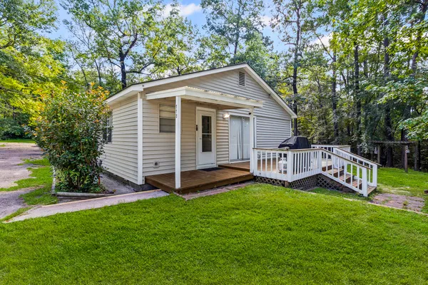 a view of balcony with wooden floor and fence