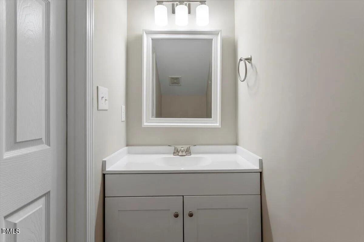 1611 Poole Road Raleigh, NC 27610 - Photo 6 of 19 a bathroom with a sink and a mirror