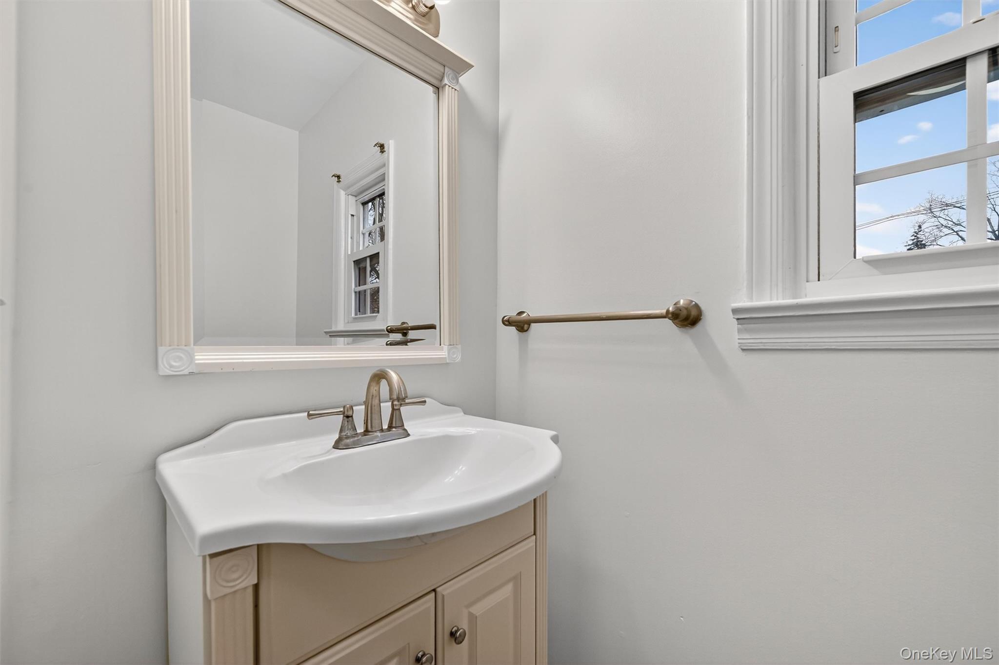 28 Alan Road Spring Valley, NY 10977 - Photo 12 of 39 a bathroom with a sink and a mirror