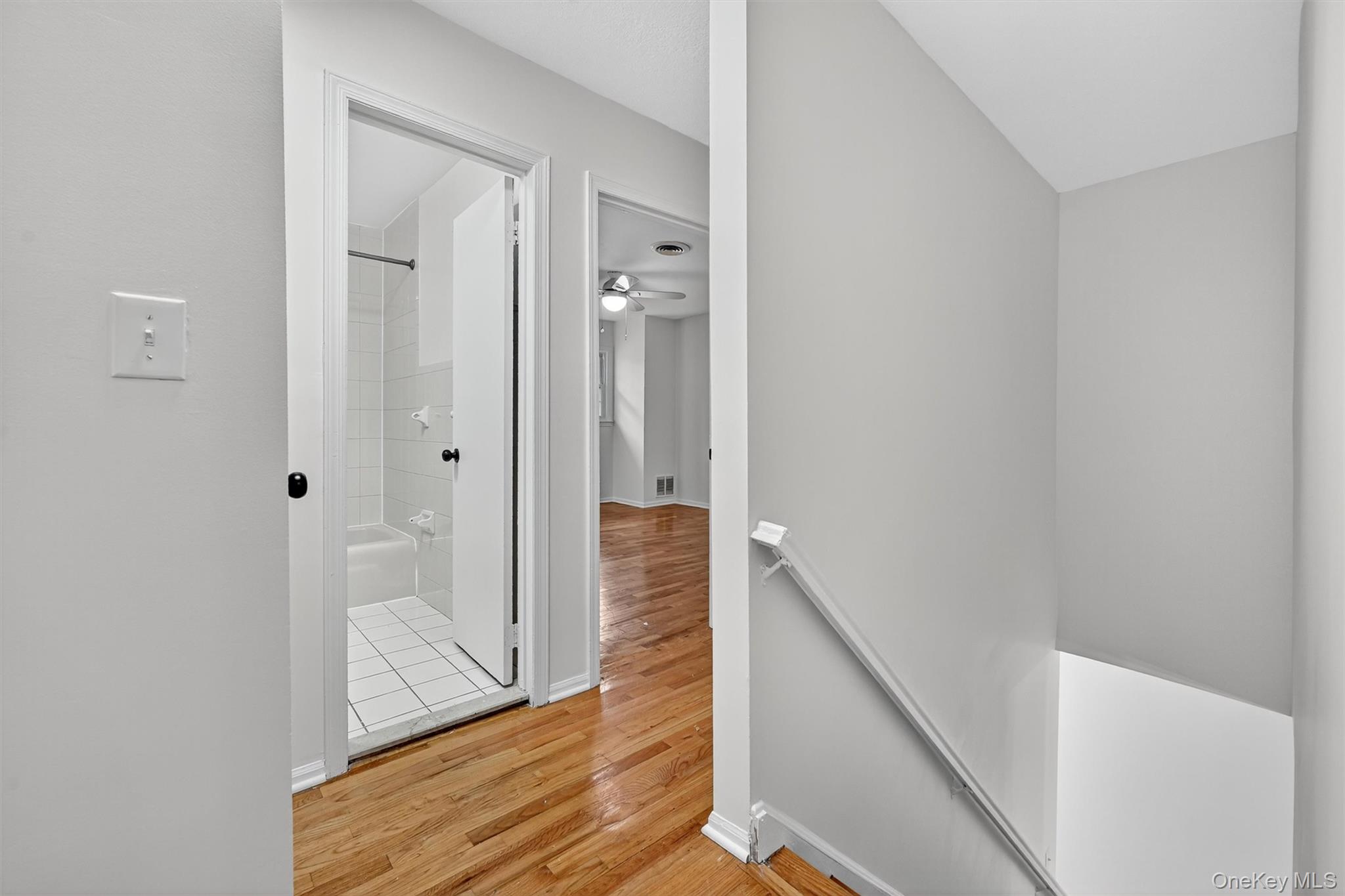 28 Alan Road Spring Valley, NY 10977 - Photo 14 of 39 a view of a hallway with wooden floor and staircase