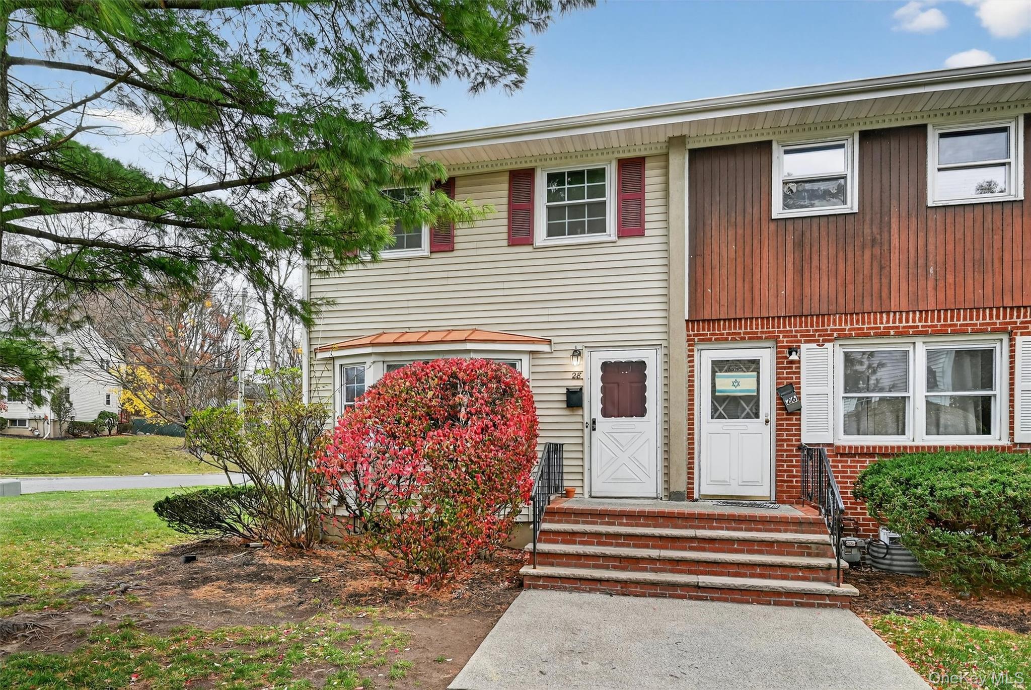 28 Alan Road Spring Valley, NY 10977 - Photo 2 of 39 a front view of a house with garden