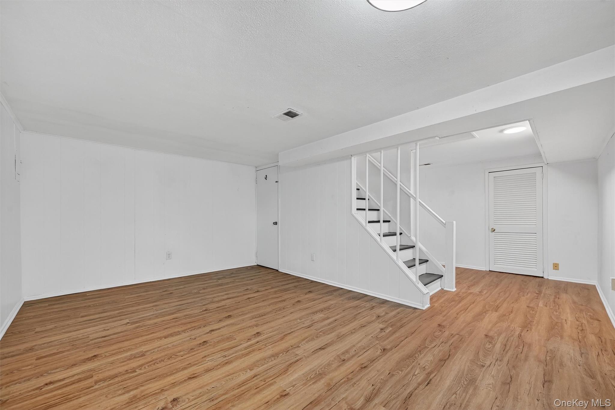 28 Alan Road Spring Valley, NY 10977 - Photo 26 of 39 a view of empty room with wooden floor