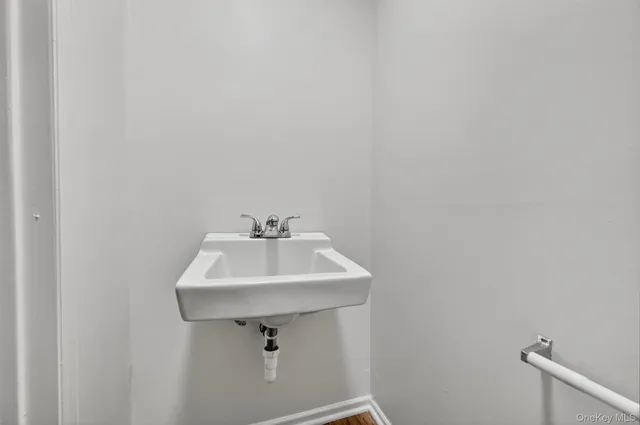 a bathroom with a sink and mirror