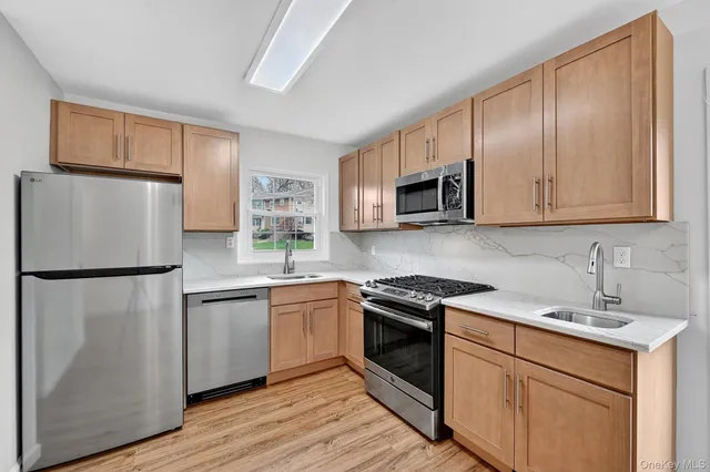 a kitchen with a refrigerator sink and microwave