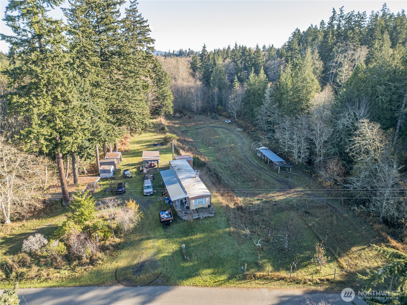 251 Gossett Road Port Angeles, WA 98363 - Photo 6 of 21 an aerial view of a house with yard swimming pool and outdoor seating