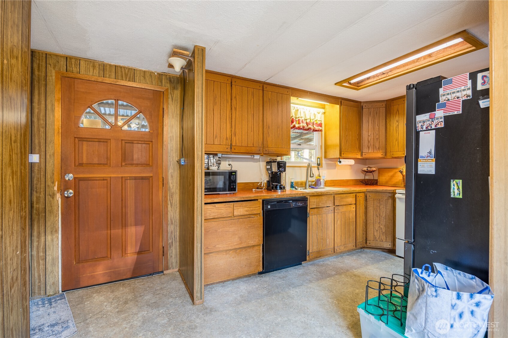 251 Gossett Road Port Angeles, WA 98363 - Photo 10 of 21 a kitchen with stainless steel appliances granite countertop a refrigerator and a stove top oven