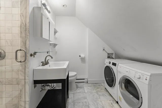 a utility room with dryer and washer
