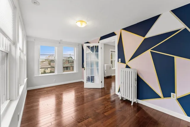 a view of entryway with wooden floor and stairs