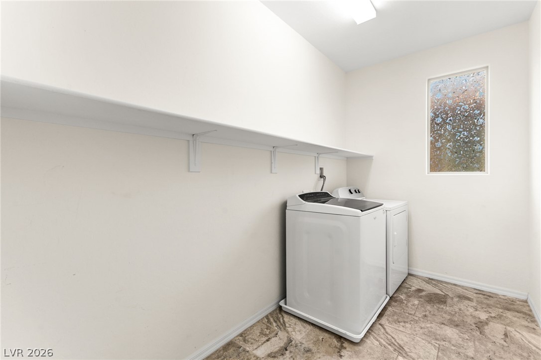 11048 Prairie Grove Road Las Vegas, NV 89179 - Photo 59 of 75 Functional laundry space with a window offering natural light.