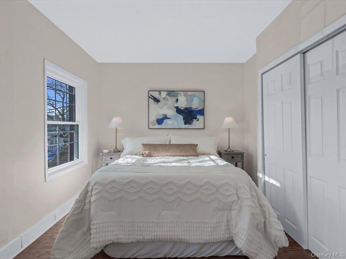 80-49 88th Avenue Queens, NY 11421 - Photo 16 of 28 a bedroom with a bed and a window