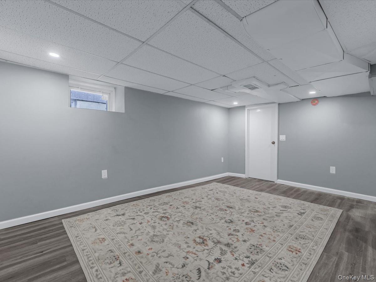 80-49 88th Avenue Queens, NY 11421 - Photo 23 of 28 an empty room with wooden floor