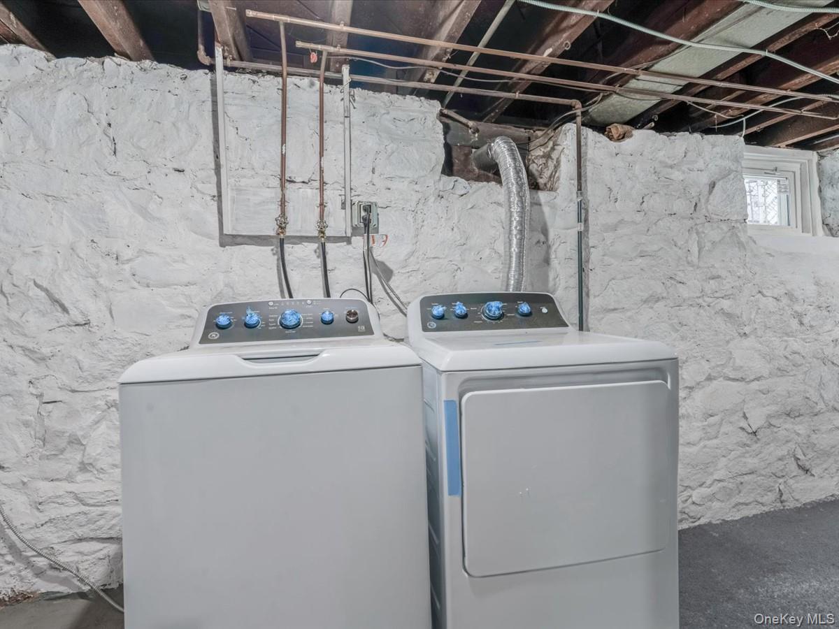 80-49 88th Avenue Queens, NY 11421 - Photo 25 of 28 a utility room with dryer and washer