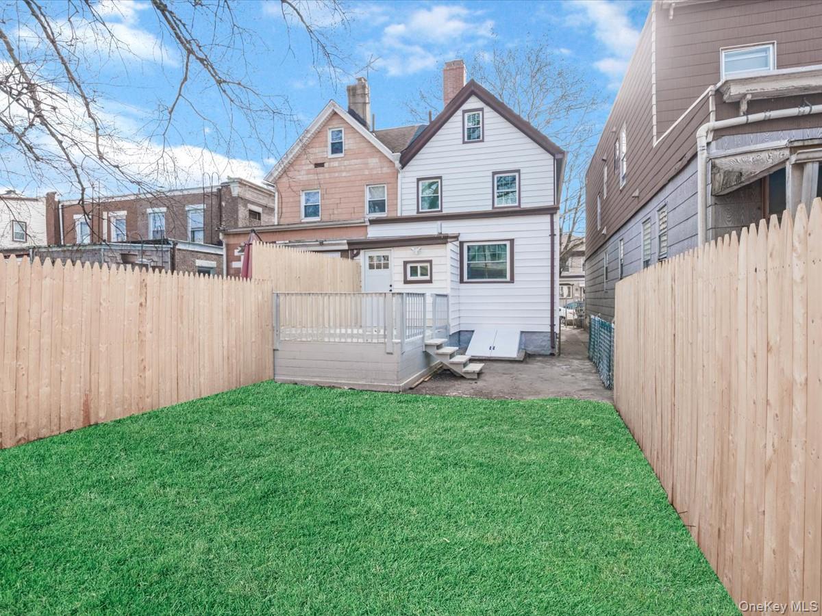 80-49 88th Avenue Queens, NY 11421 - Photo 28 of 28 a view of a house with backyard and sitting area
