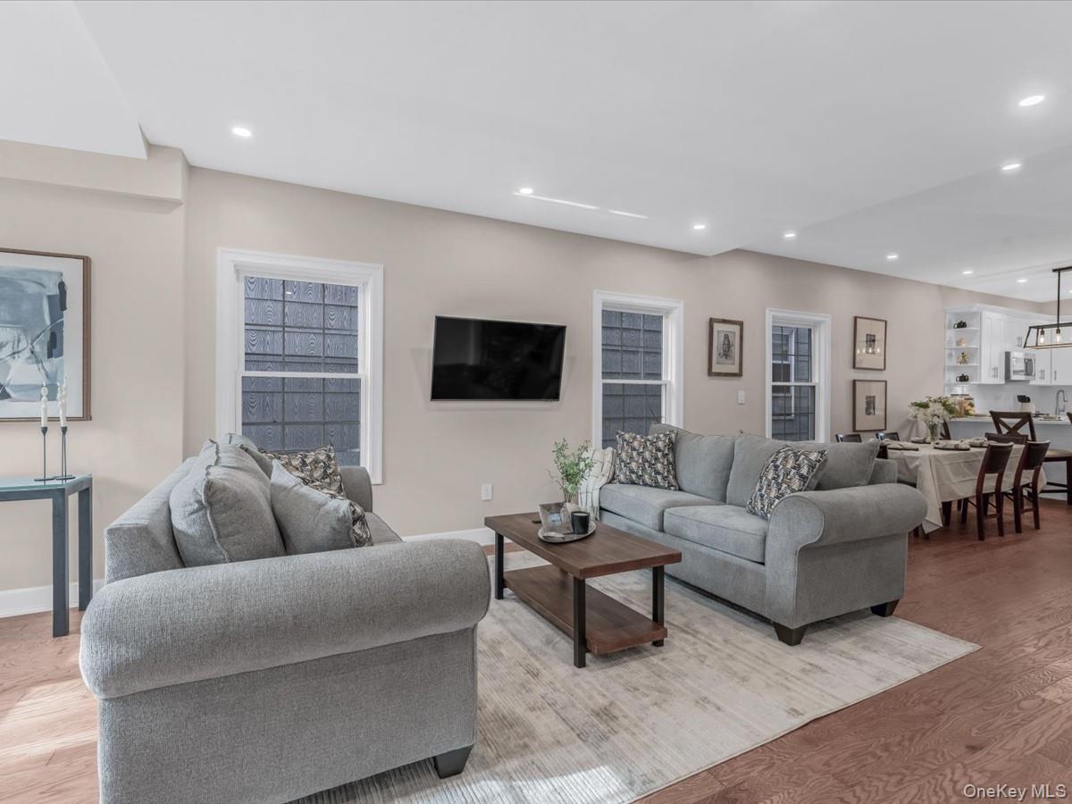 80-49 88th Avenue Queens, NY 11421 - Photo 3 of 28 a living room with furniture and a flat screen tv