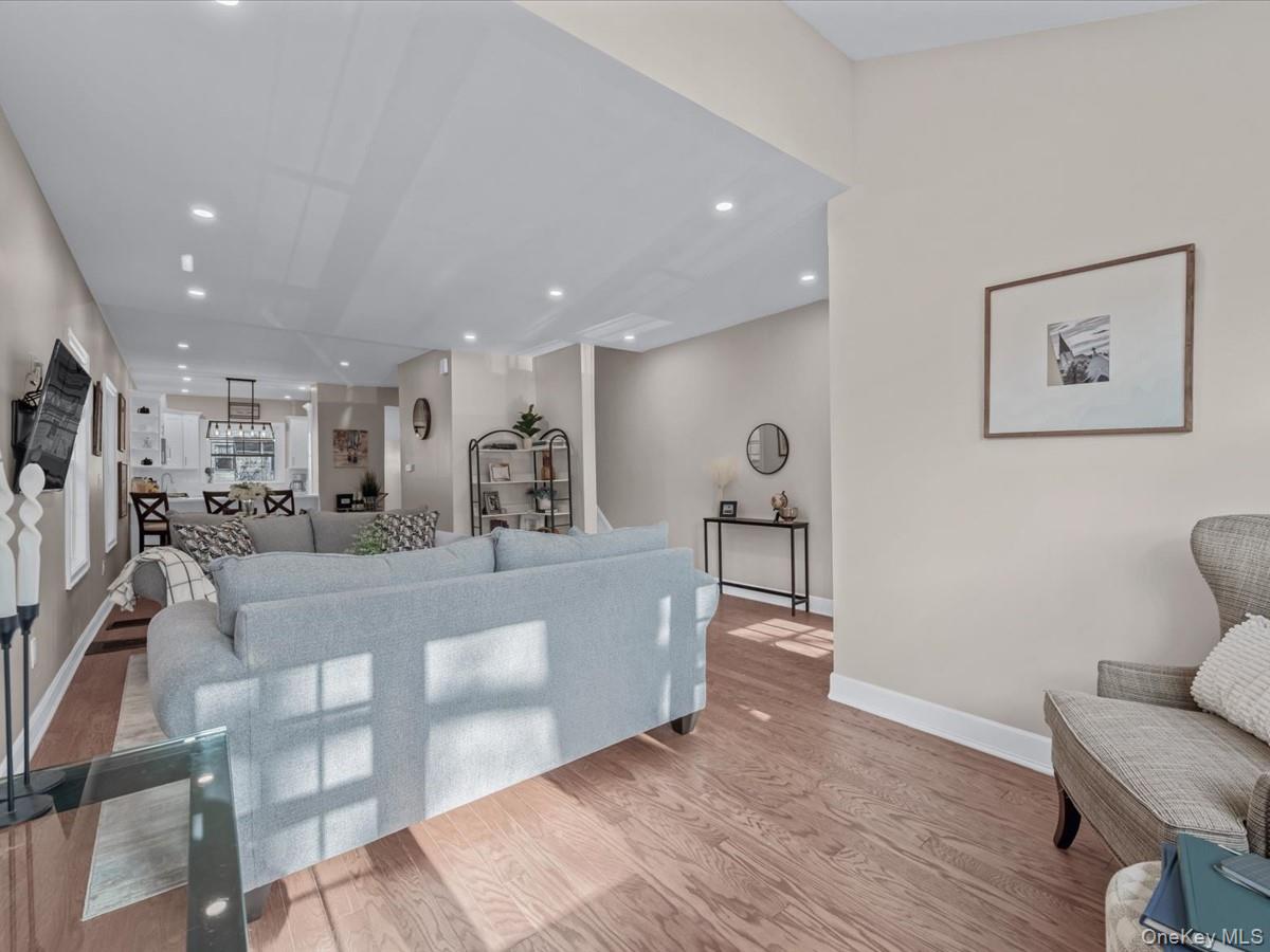 80-49 88th Avenue Queens, NY 11421 - Photo 7 of 28 a view of a living room kitchen and a wooden floor