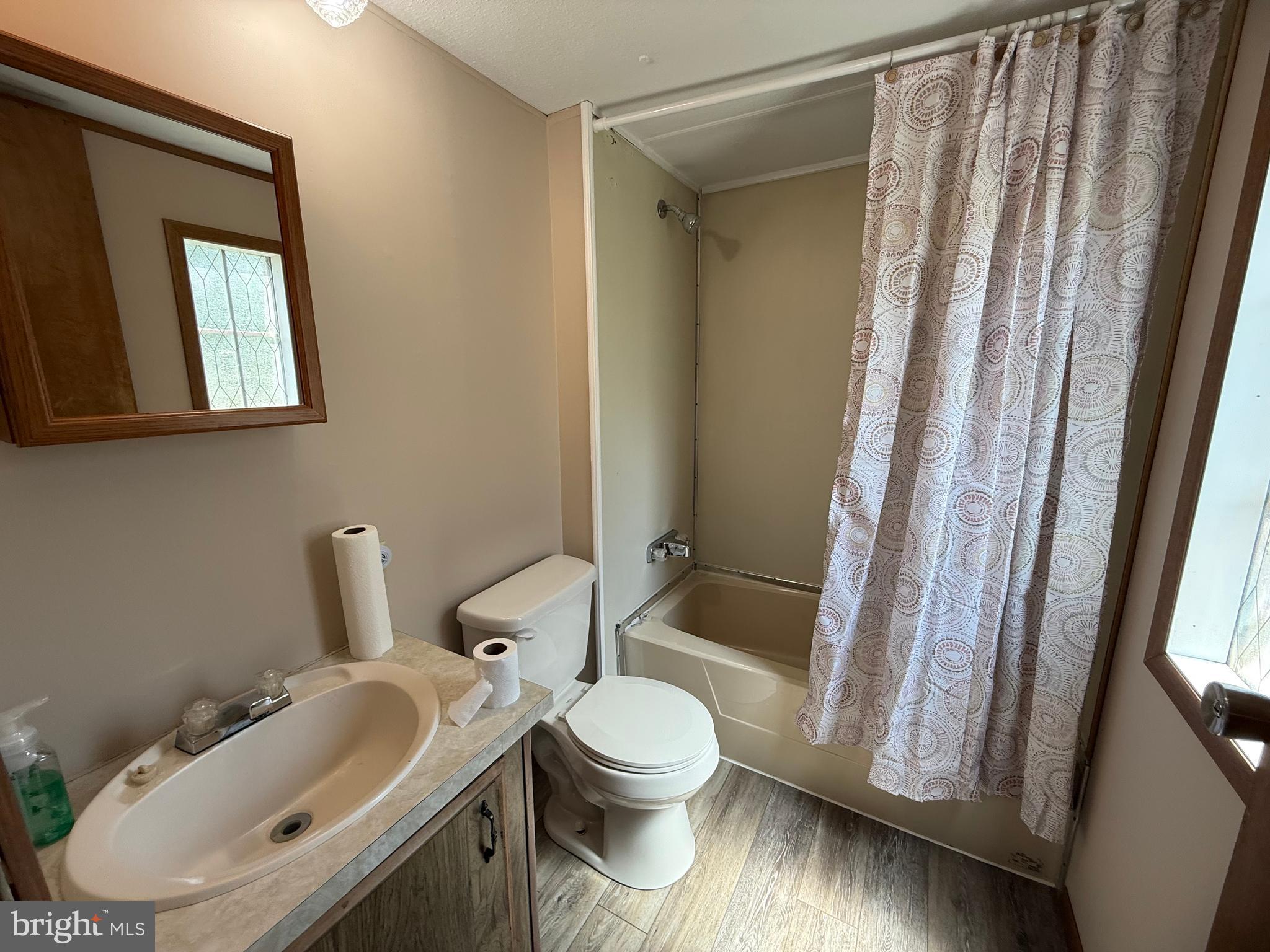 192 AA Rogers Road Augusta, WV 26704 - Photo 26 of 34 a bathroom with a toilet sink and a mirror