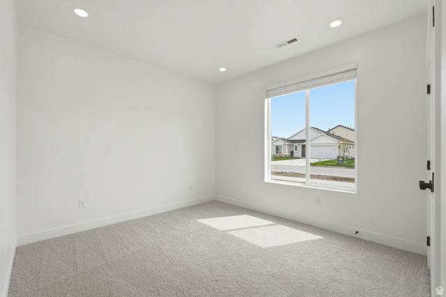 401 West 3085 South, Unit 329 Nibley, UT 84321 - Photo 34 of 34 Spare room featuring light carpet and recessed lighting