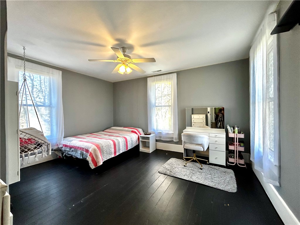 2086 Scheyhing Road Lewisburg, OH 45338 - Photo 18 of 29 This spacious bedroom features ample natural light and rich, dark flooring.