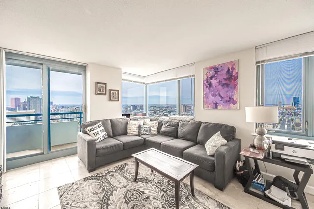 a living room with furniture and a rug