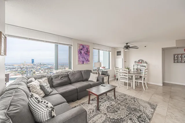 a living room with furniture and a rug